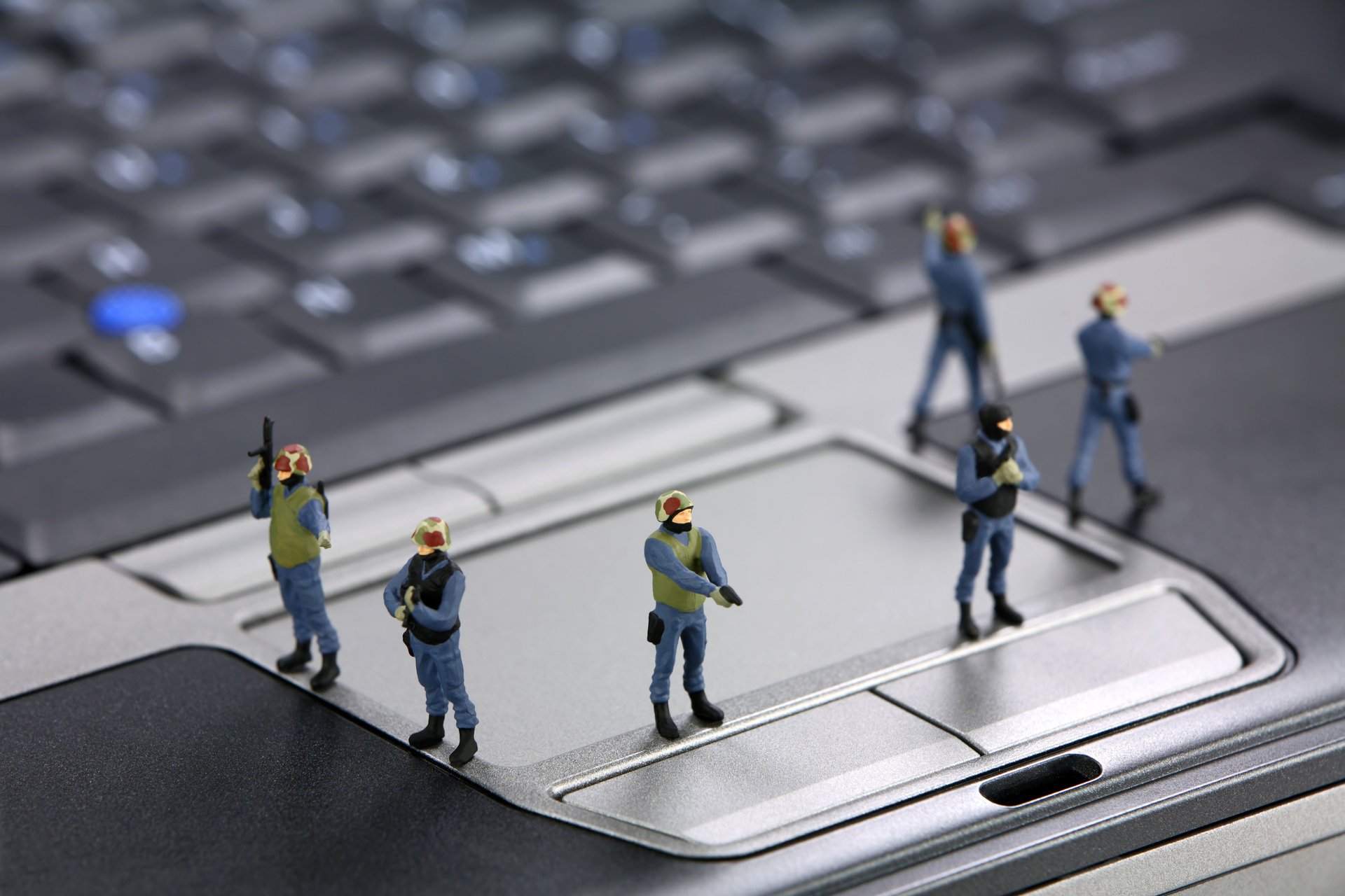 hi-tech technology notebook touchpad laptop hard drive the device storage information security figures engineers programmers special forces guard police spetsnaz ok blur bokeh wallpaper