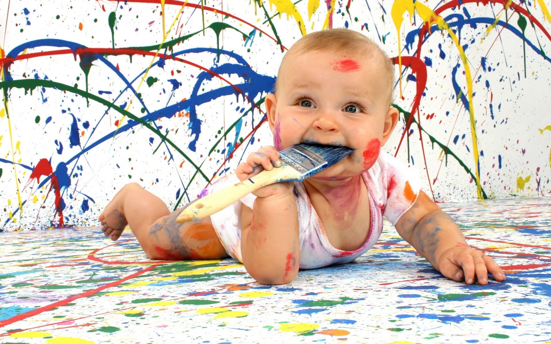 baby artist all in paint look face eyes portrait