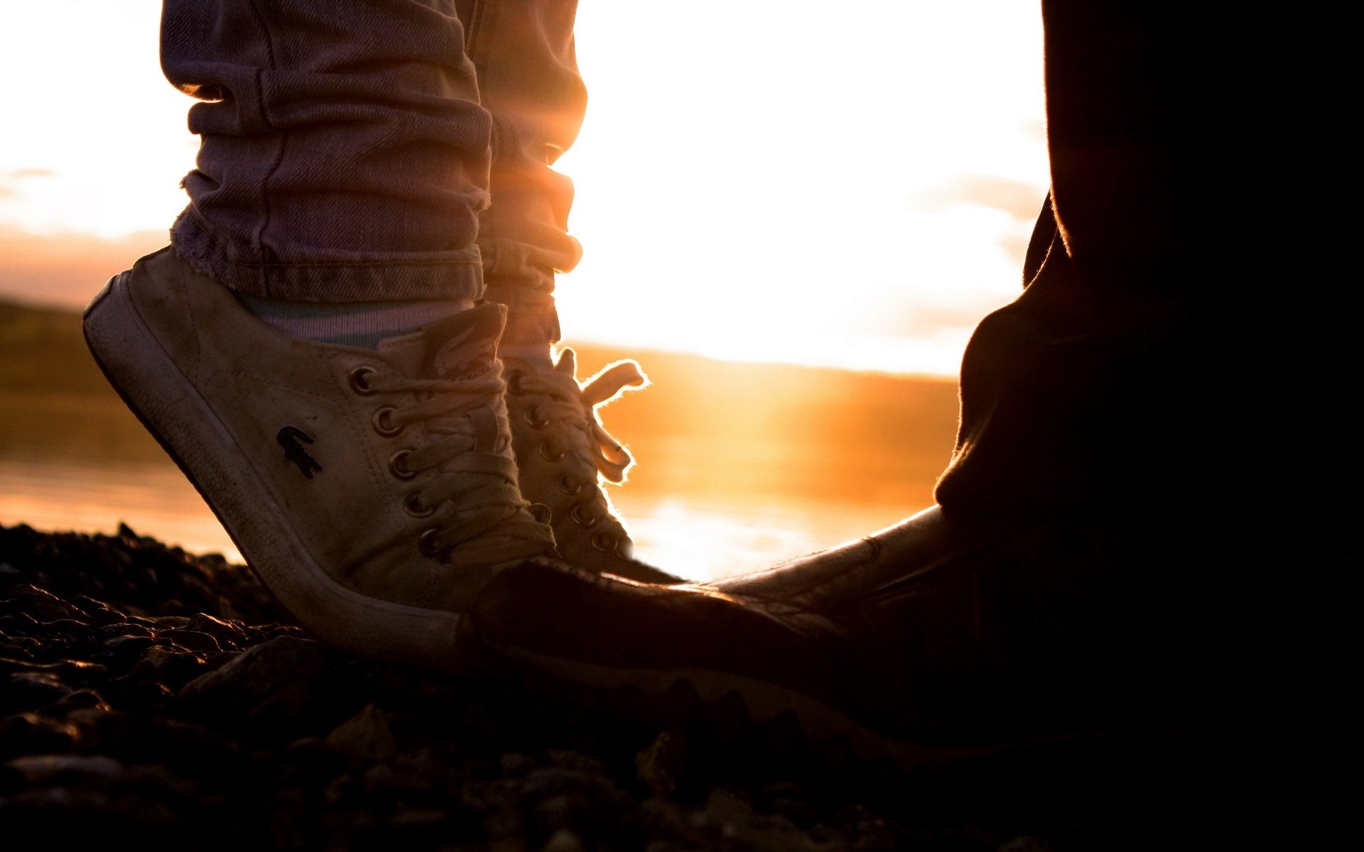 lacosta he and she sunset shoes feet sneakers sunset rays photo