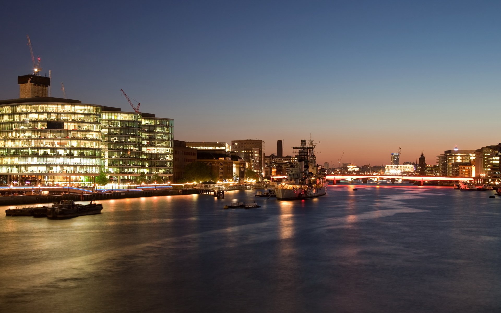 quiet marina yachts lights in windows high-rise buildings cities night night sky city lights boats boats smooth surface water river lights sky bright light reflection