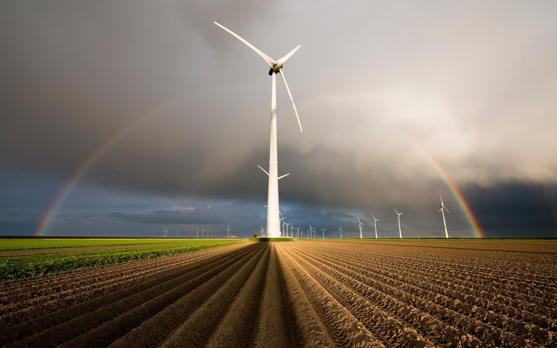 the field wind turbines rainbow