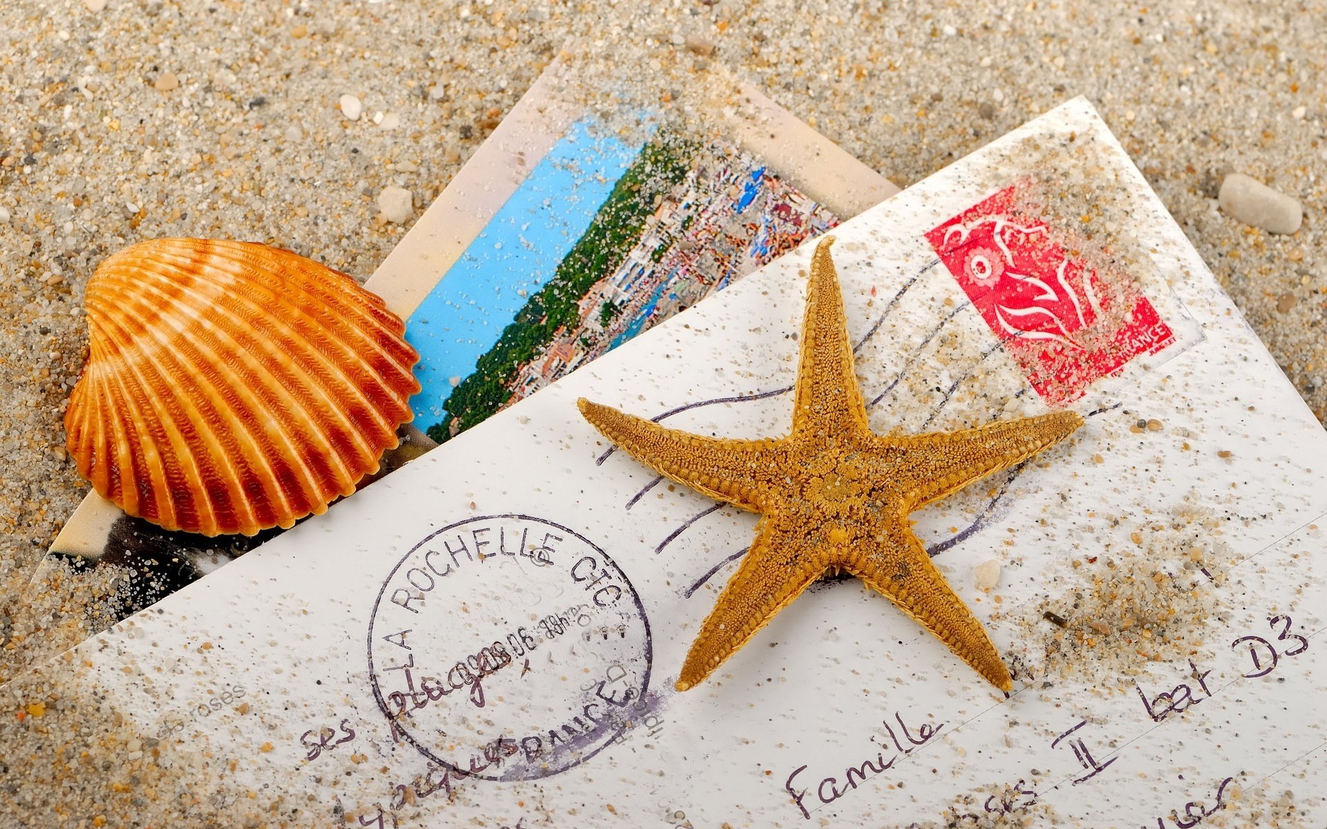 stelle marine conchiglia lettere sabbia busta foto sabbia vacanza vacanze