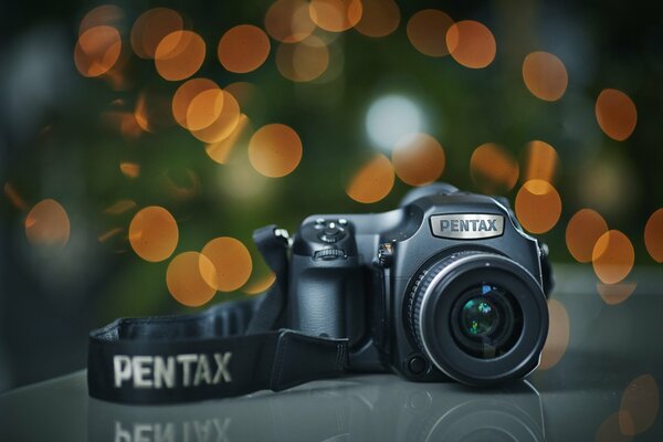 The pentax645 camera slides on a green background with orange highlights