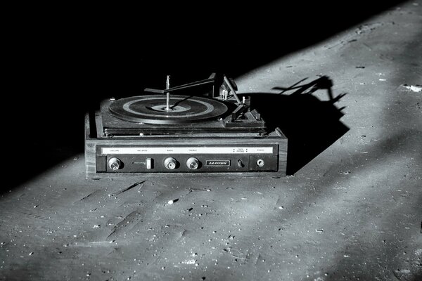 Turntable with a record on a gray background