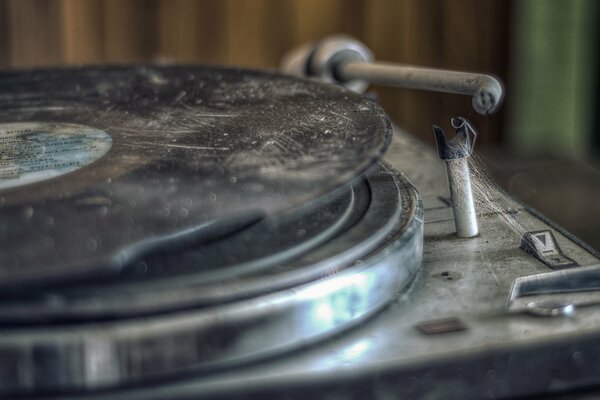 An old dirty record player with a record