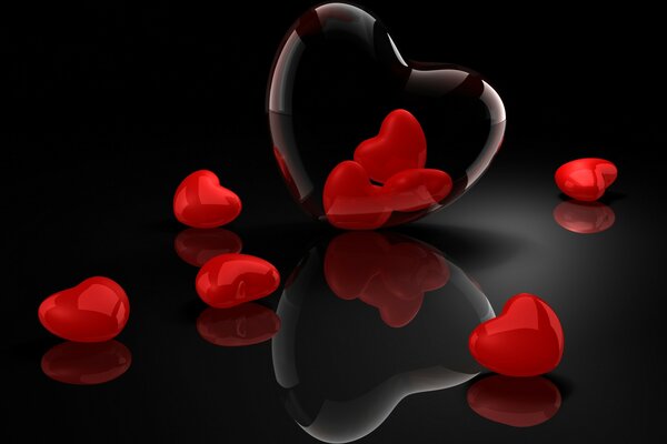 Sobre un fondo negro, corazones rojos y transparentes