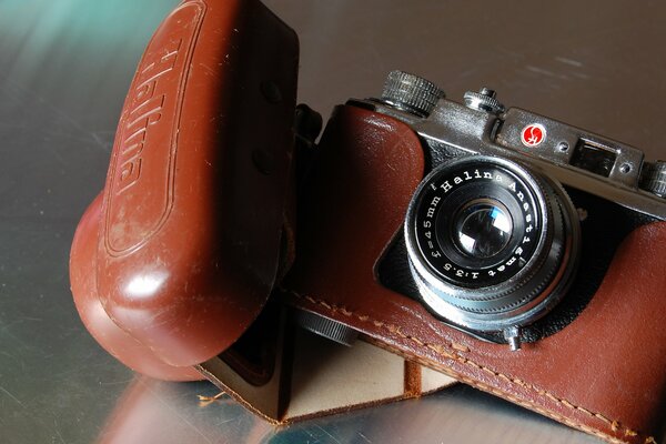 An old camera in a leather case