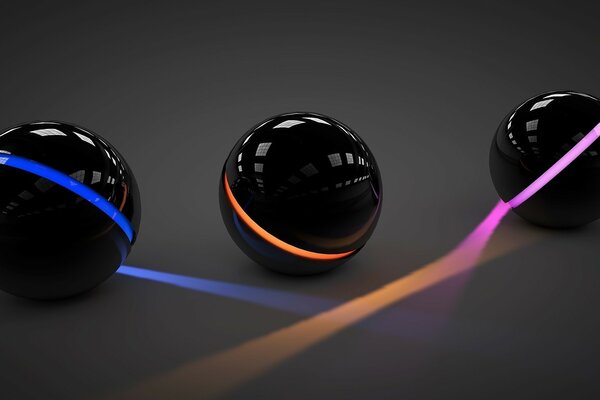 Une lumière au néon qui émet des boules noires lisses