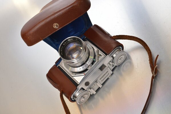 An old camera on a light background