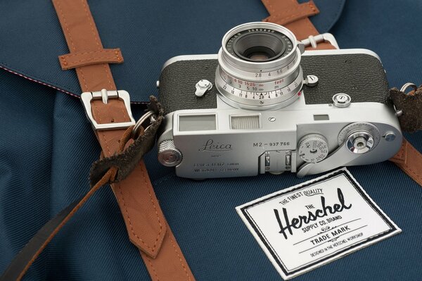 Camera watering can lying on a backpack