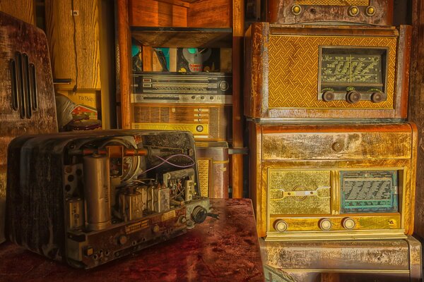 An old yellow radio set against an antique background