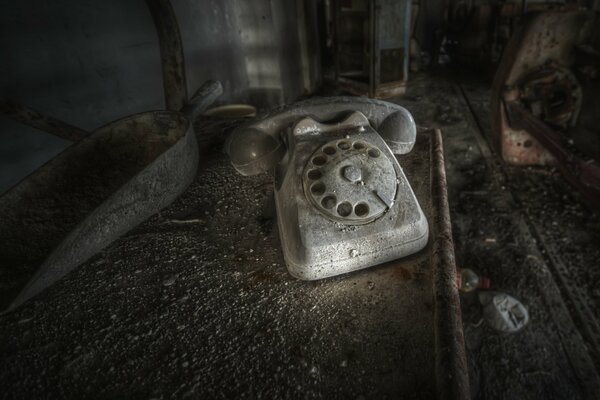An old disk phone on a dark background