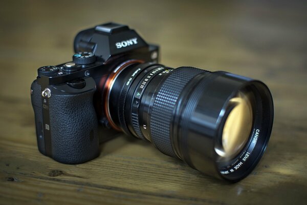 Sony s camera on a wooden table