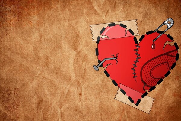 A painted bleeding, punctured, stitched heart. The heart, glued to the wall, on tape