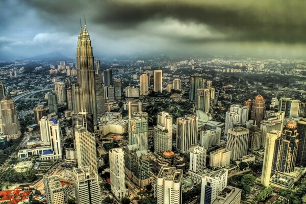 View of the skyscrapers of the metropolis under the clouds