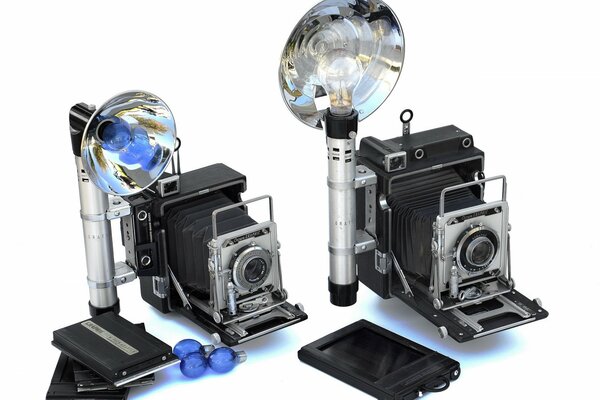 Su sfondo bianco-fotocamere d epoca con flash