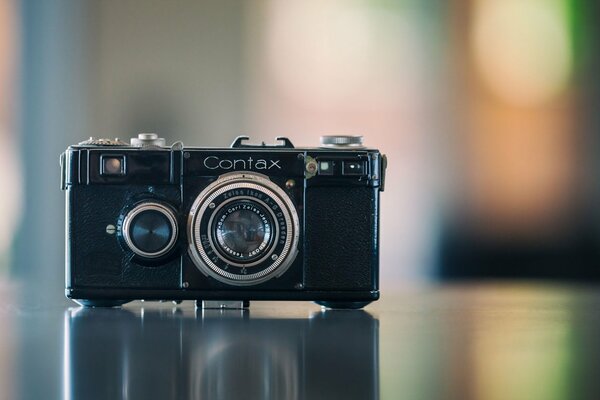 Camera on a blurry colored background