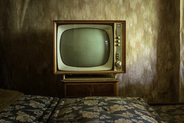 TV with a bedside table of the past centuries