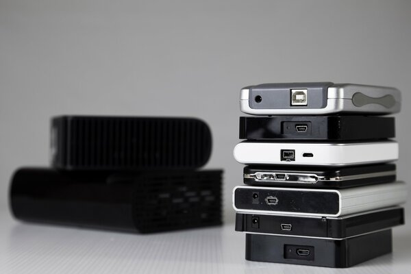 Portable hard drives are stacked