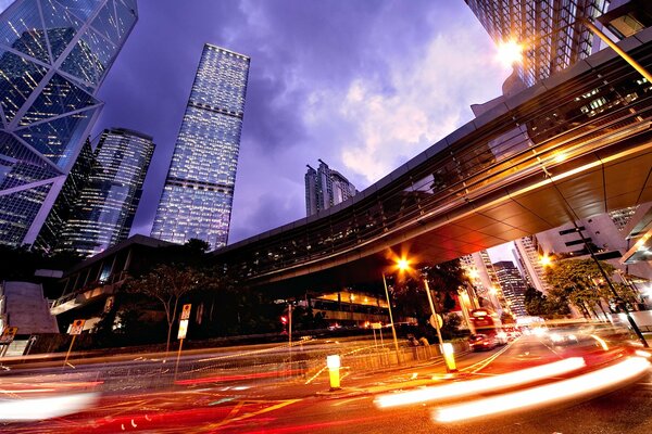 The road and the bridge in the lights of the night city