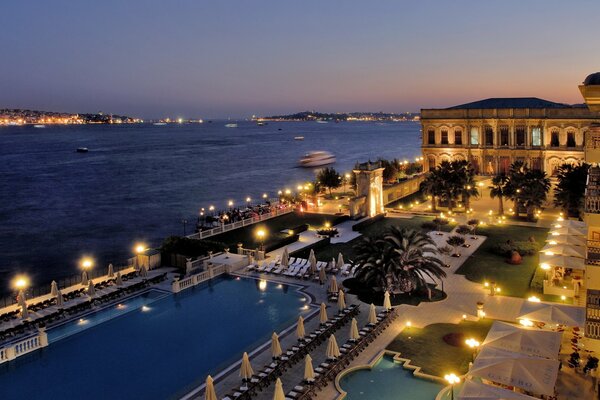 The territory of the hotel on the seashore under the night sky