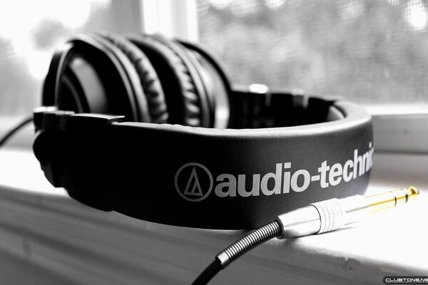 Headphones on the windowsill. Close-up
