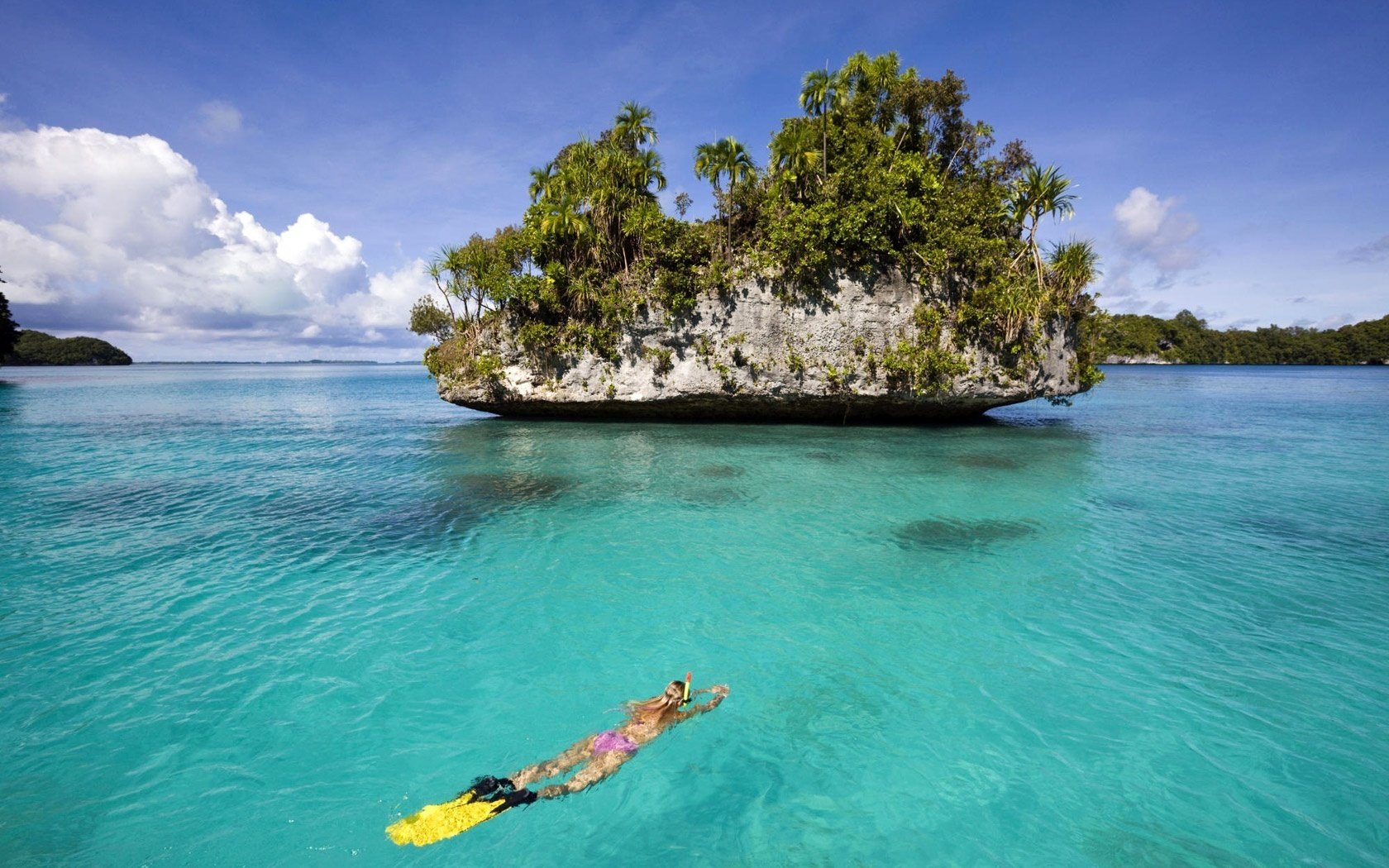 the crystal-clear depths island diver water the sky sea clouds blue sky tourist swimming the bottom the ocean horizon nature landscape palm trees summer heat stay resort vacation