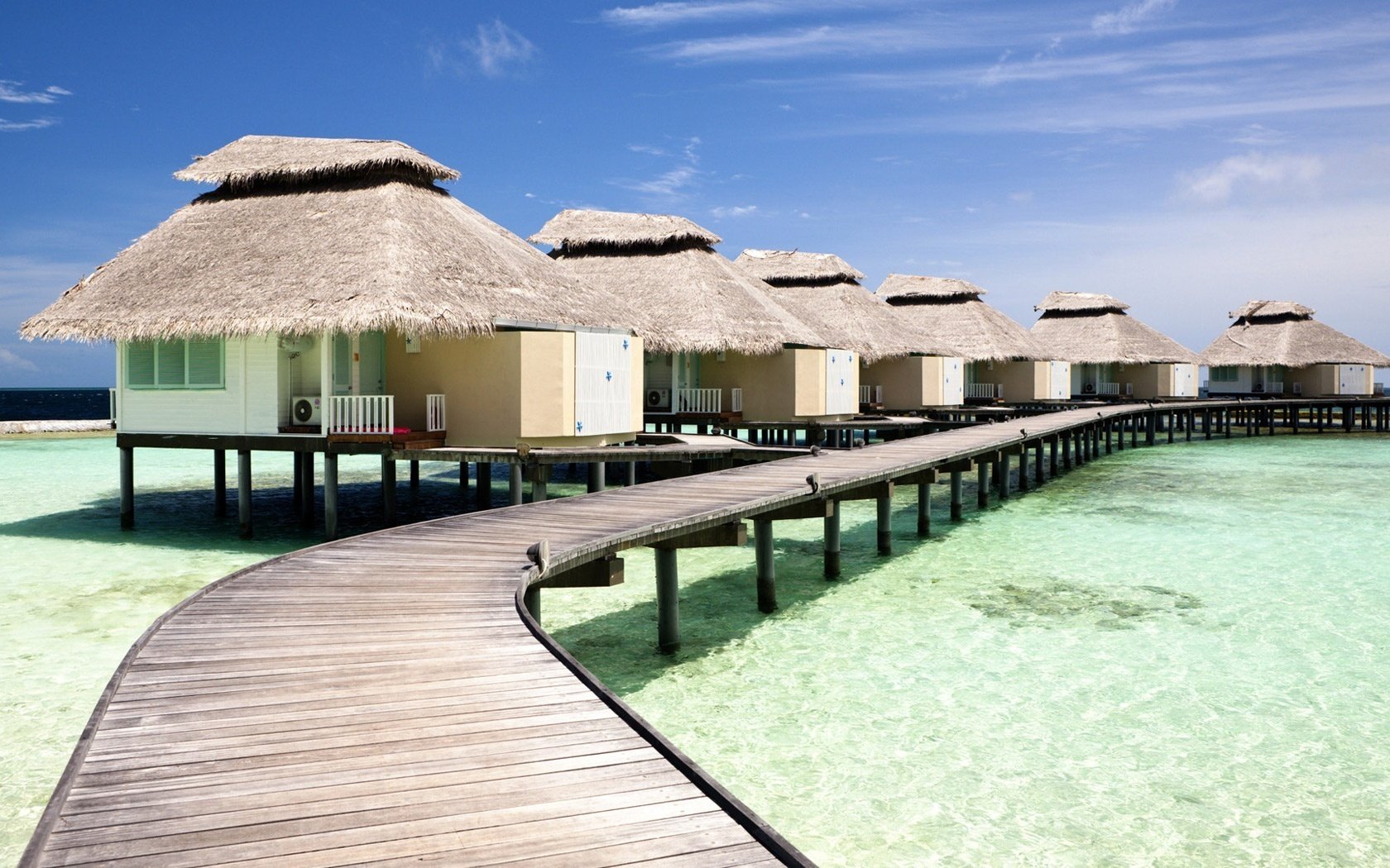 casas de vacaciones agua intermitente muelle arena blanca playa resort mar muelle muelle trópicos paraíso vacaciones calor calor naturaleza paisaje nubes