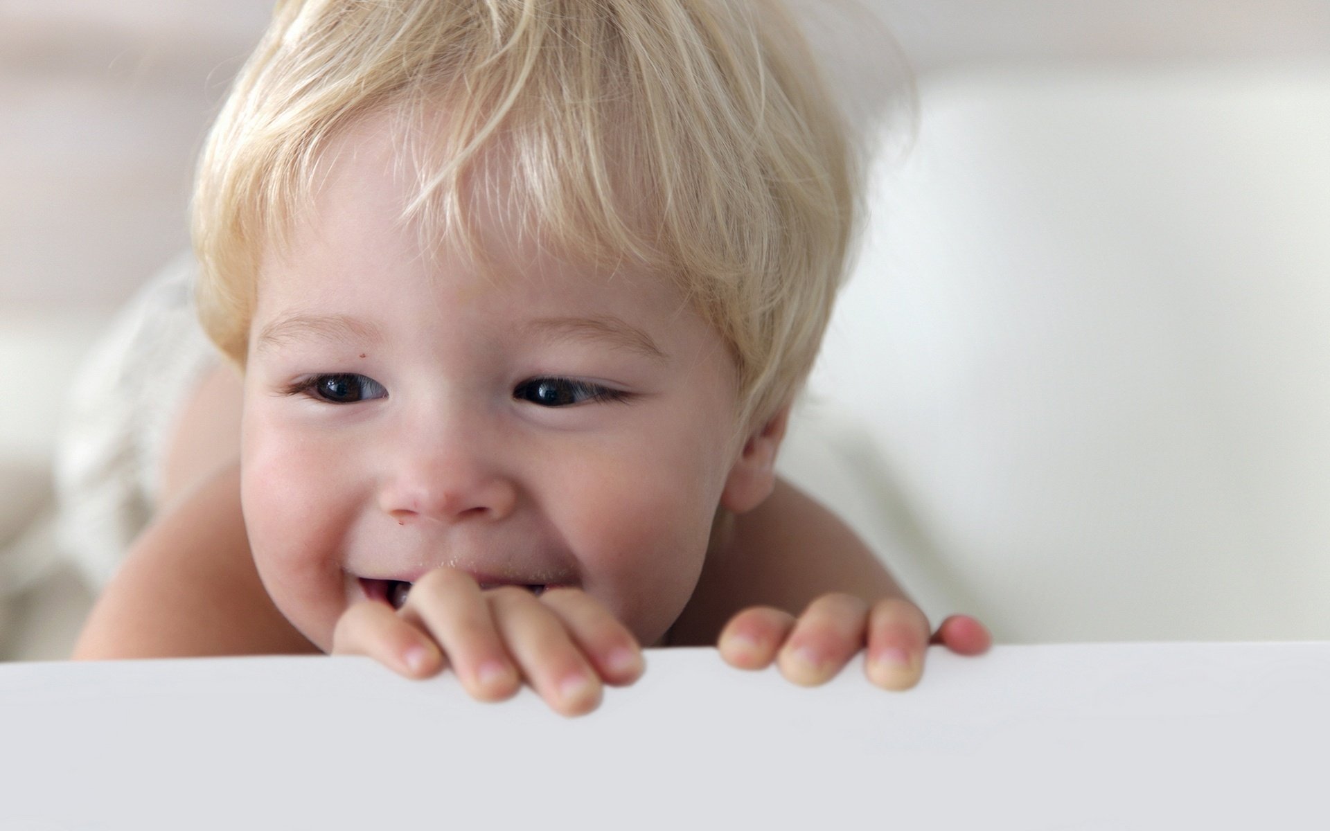 the blond boy smile dark eyes portrait look eyes blonde face