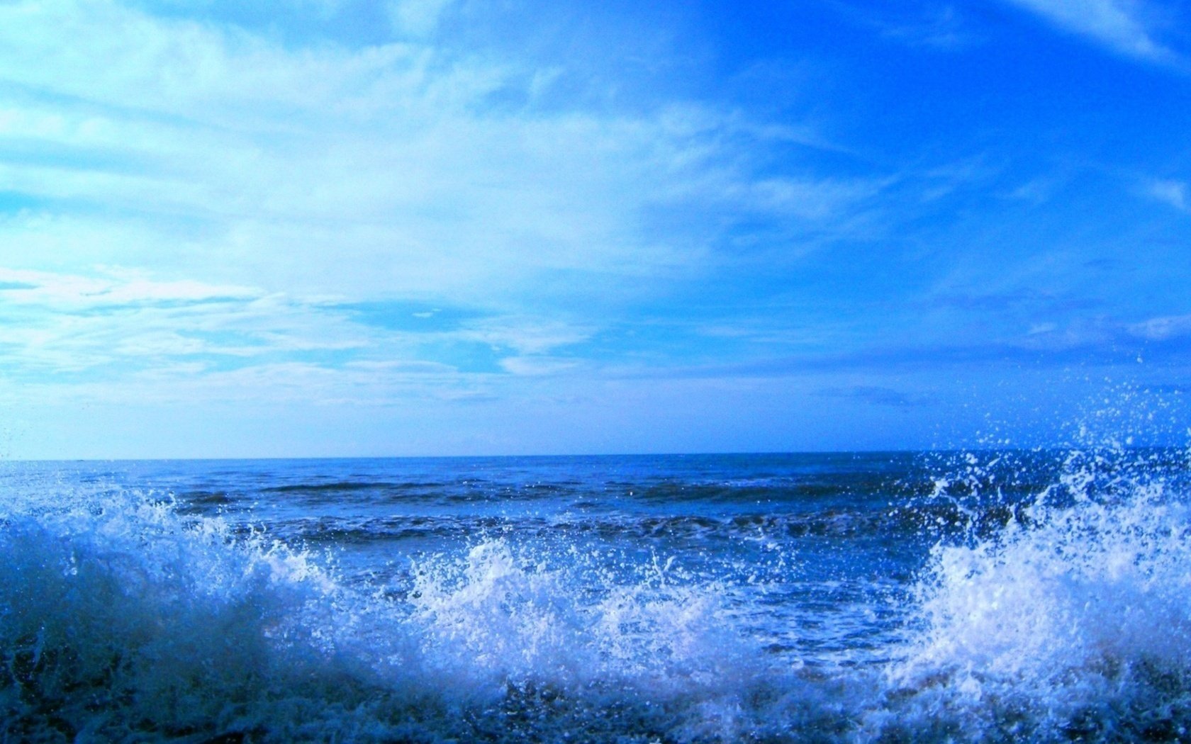 blue water water splashes wind water sky surf horizon sea waves blue sky blue water