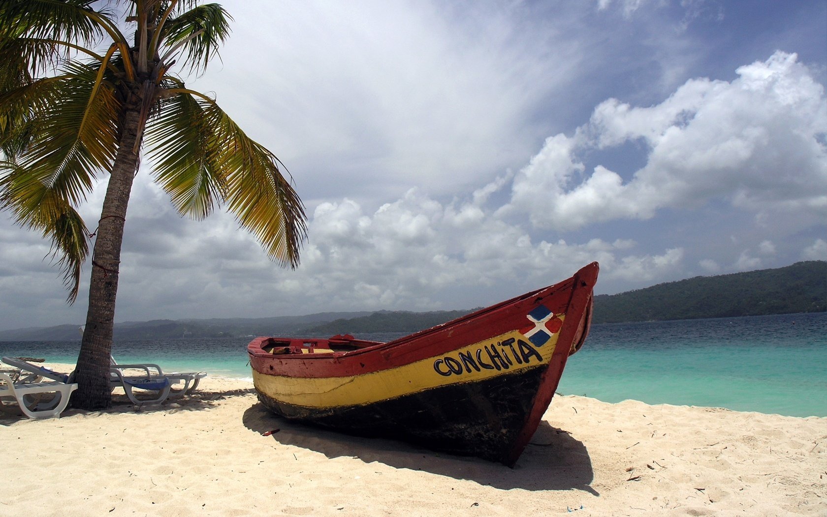 torm clouds boat the wind beach shore palm trees the sky sun loungers cool summer tree sand