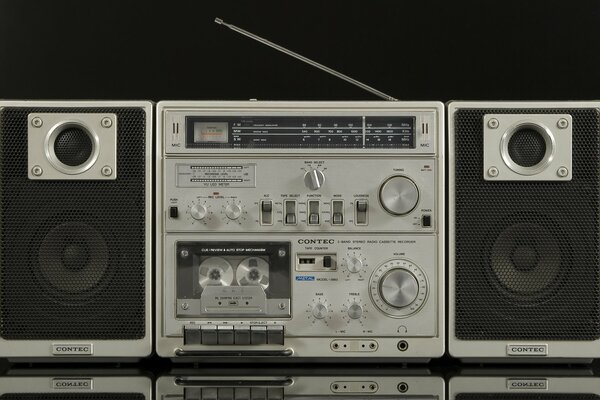 Retro tape recorder contec 3883 on a black background