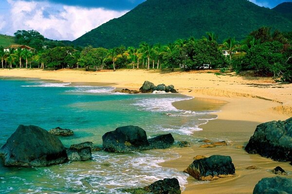 An island with big rocks and yellow sand