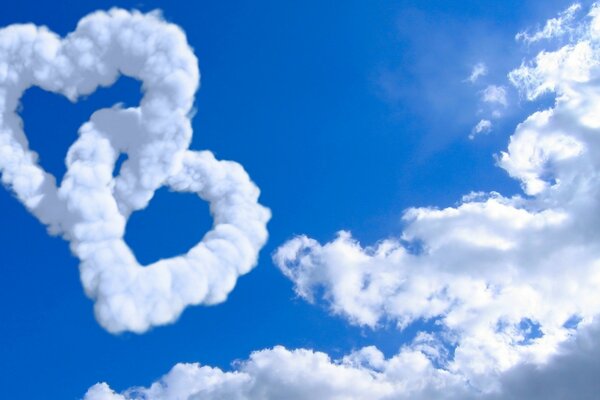 Clouds in the form of two hearts in the blue sky