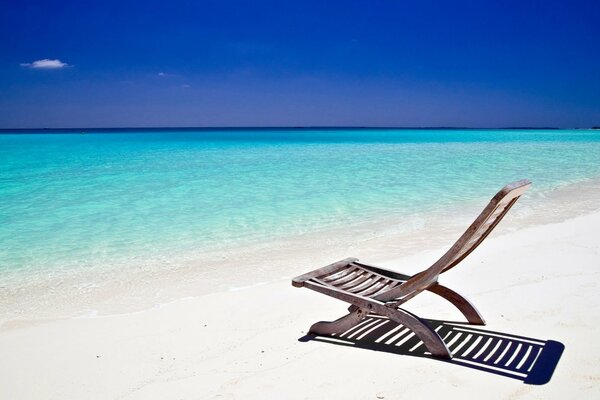 Chaise longue on the ocean