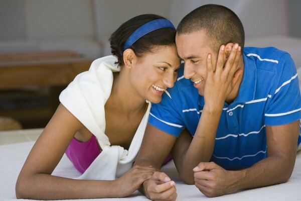 Smiling couple on the bed