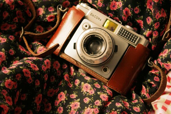 Vintage camera on floral fabric