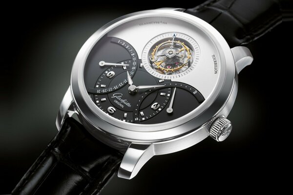 A watch of modern laconic design on a cadence strap