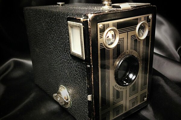 Vintage kodak camera on black fabric