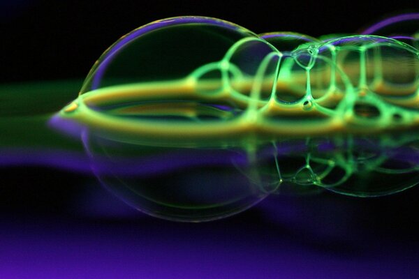 Colored bubbles on dark blue water