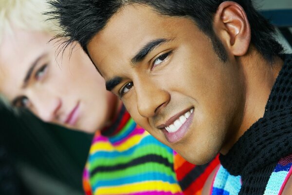 Two young men in bright clothes