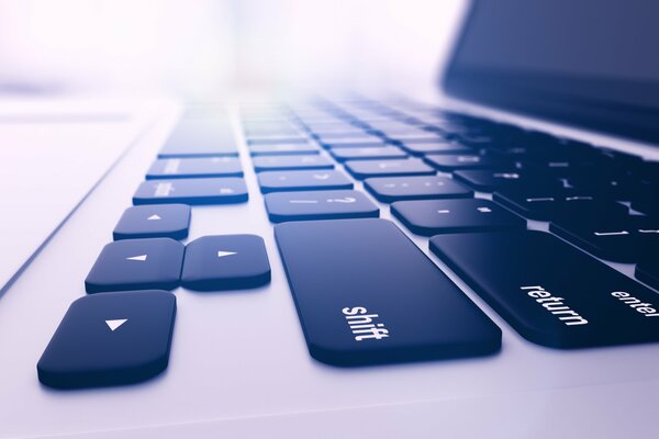 Macro photography of a laptop keyboard with flat keys, side view