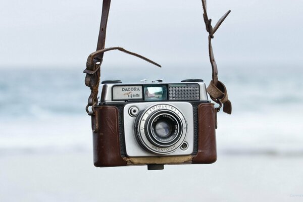 THE CAMERA SWINGS ON A SWING BY THE SEA