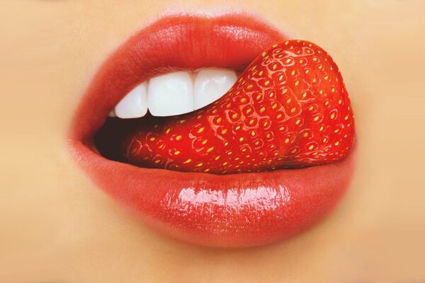 The tongue in the form of strawberries passionately licks the lips