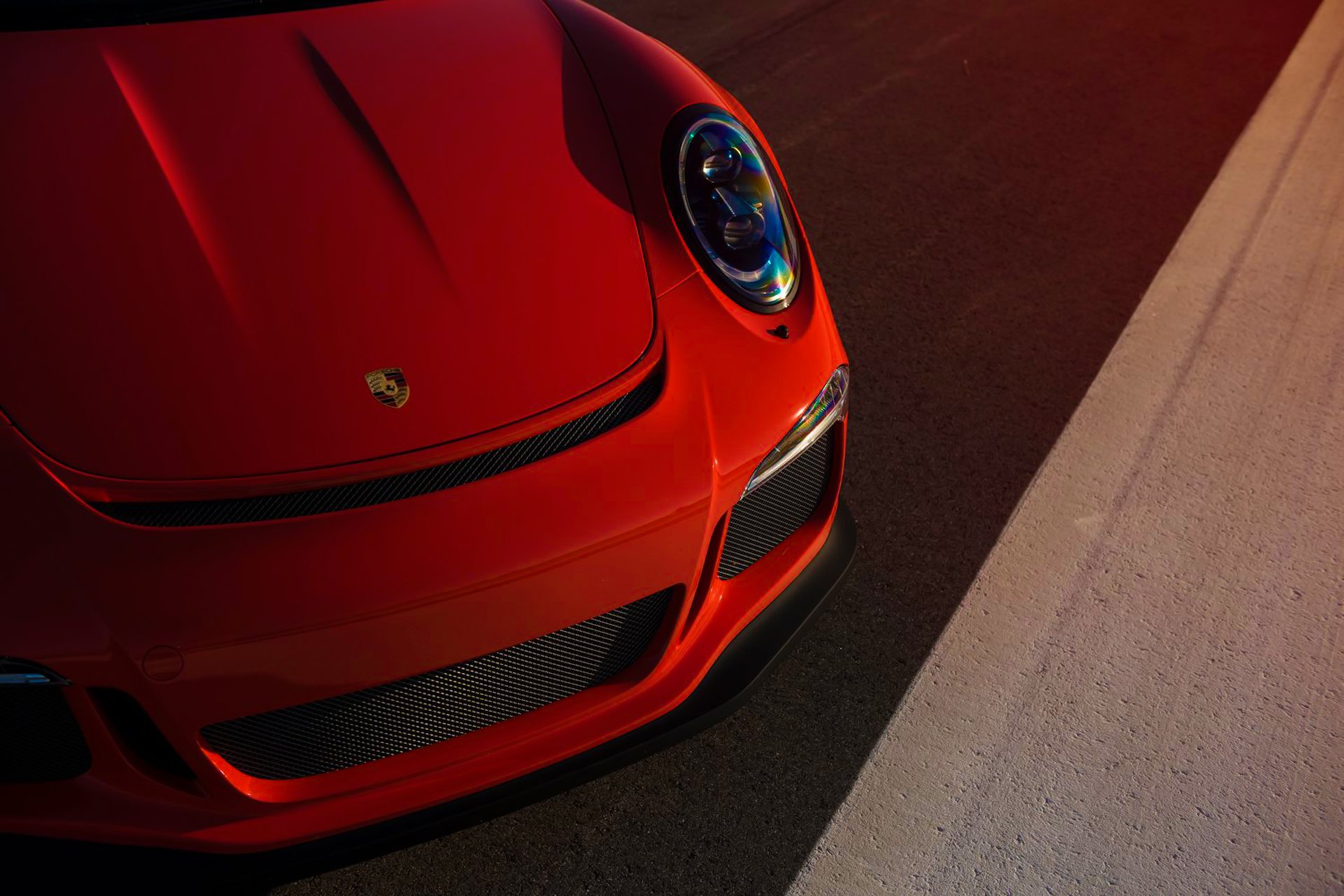 porsche 911 gt3rs pomarańczowy kolor supercar przednie światło słońce