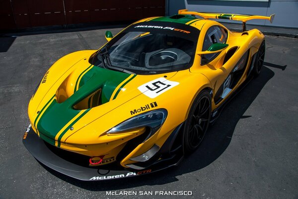 Yellow green mclaren gtr r1 2015 on asphalt