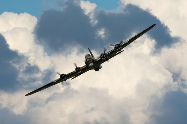 TURBOPROP AIRCRAFT IN THE SKY BEFORE THE RAIN