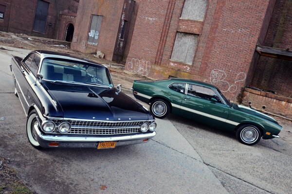 Two Fords at a brick building