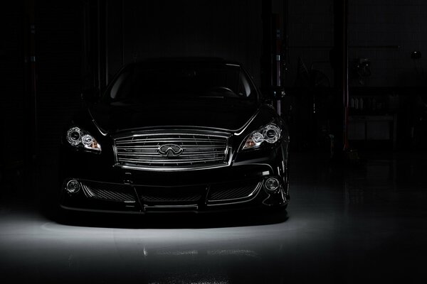 Black infiniti on a dark background