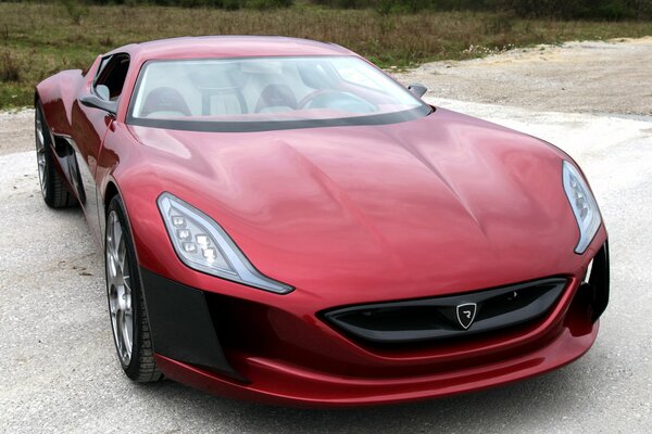 Unusual red car on the road